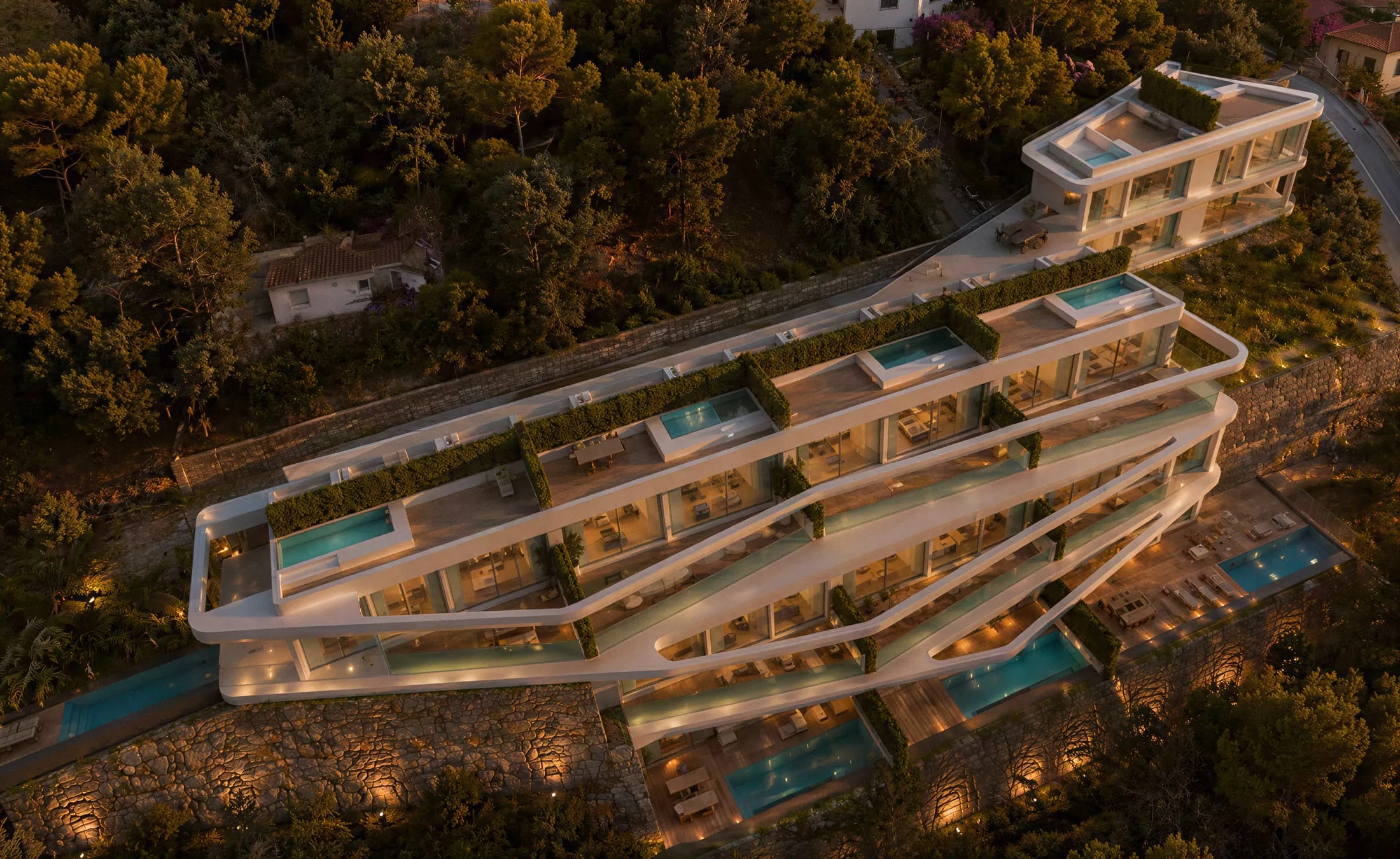 Twelve residences stepping down the hillside.